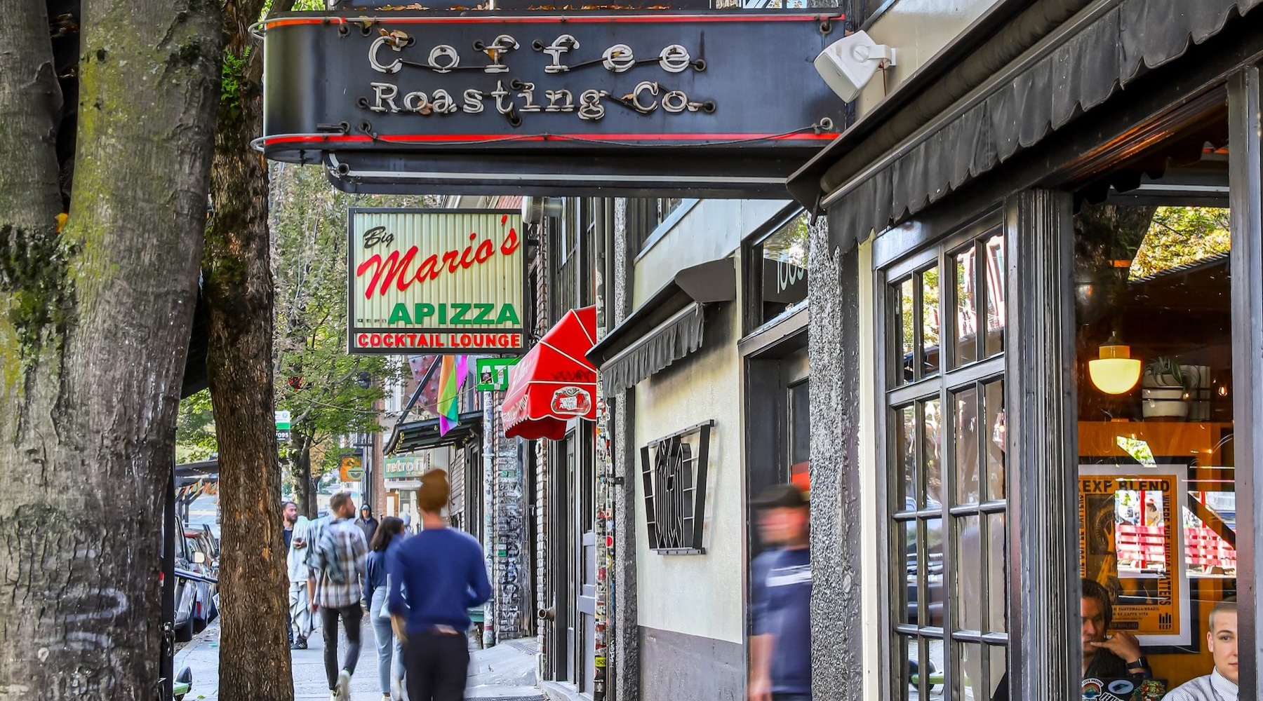 people walking in front of restaurants