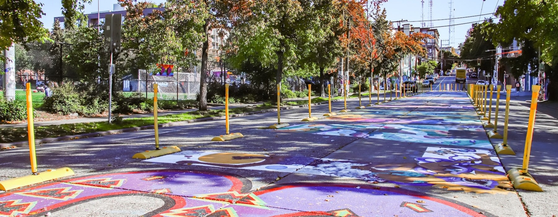 a colorful paved area with trees